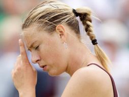 Reacción de Sharapova al perder un punto durante la competición con la china Li Na. AP  /
