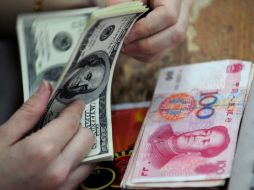 En los últimos dos años el yuan chino se depreció hasta 30% frente a otras monedas nacionales. AP  /