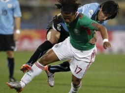 La mejor participación de México estuvo a cargo de Giovani dos Santos, ante Uruguay. AP  /