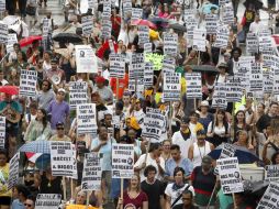 Cientos de personas participan en un rally contra la ley Arizona, en Boston. AP  /