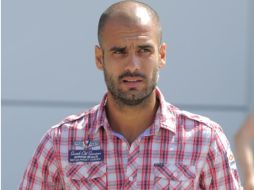 Josep Guardiola en su llegada a la conferencia de prensa de hoy. AP  /