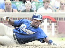 Miguel Tejada anota una carrera. AP  /