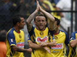 Los jugadores del América festejando su victoria de la pasada Jornada del torneo Apertura 2010. AP  /