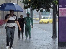 Imagen de una lluvia torrencial que azotó la ciudad en días pasados. ARCHIVO  /