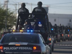 Policías federales asumieron la seguridad de Ciudad Juárez para ir relevando al Ejército. AP  /