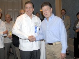 La Asamblea convocó a mandatarios latinoamericanos como el presidente colombiano Santos (derecha). NTX  /