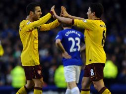 Los jugadores del Arsenal festejando su victoria en el partido de la Liga Premier. AFP  /
