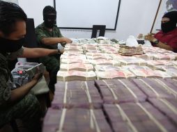 Dinero decomisado en un operativo. Procuradores del país apoyan reformas contra el lavado de dinero. REUTERS  /
