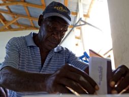 A pesar de los problemas validan elecciones en Haití. AFP  /
