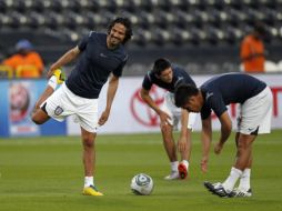 Los jugadores del Pachuca se preparan para su choque ante el Mazembe. AP  /