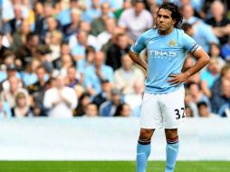 El jugador argentino Carlos Tévez espera que el Manchester City reconsidere su decisiòn de dejarlo salir del club. AFP  /