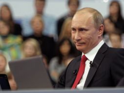 El primer ministro de Rusia Vladimir Putin asegura que el Mundial y JJOO harán más saludable a su país. AFP  /