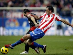 Atlético de Madrid y Racing de Santander resolvieron con empate un partido soporífero. EFE  /