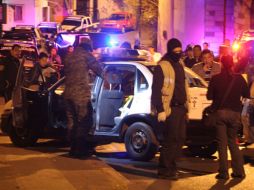 Investigadores recolectan evidencia en Cuernavaca, luego de que un agente de Tránsito fue ejecutado y otro herido por delincuentes. NTX  /