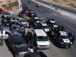 Agentes federales realizaron hoy un operativo donde arrestaron a uno que los presuntos colaboradores en la fuga. EFE  /