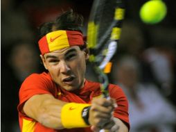 Foto de acción de Rafael Nadal quien consiguió la victoria para España a pesar de ya estar en cuartos de final. AFP  /