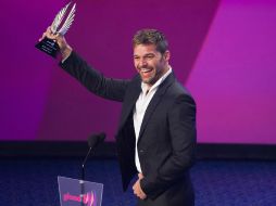 El artista agradeció a sus padres y a su novio e invito a Latinoamerica a compartir el amor. AP  /