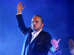 Adolescentes, jóvenes y familias enteras se reunieron para disfrutar del concierto de Bosé. AFP  /