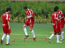Torres (der.) siempre ejecuta los trabajos con mucha concentración. MEXSPORT  /