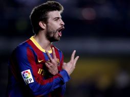 Gerar Piqué celebrando una anotación en el duelo ante el Villarreal. AP  /