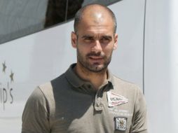 Josep Guardiola antes de entrar a una conferencia de prensa. EFE  /