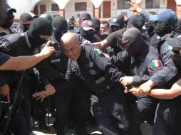 Los familiares de los policías abatidos recibirán apoyo. AP  /