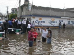 Conagua afirmó que ya se realizan trabajos de bombeo para reducir el nivel de agua en zonas inundadas. NOTIMEX  /