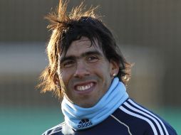 Tevez sigue sonriendo a pesar de su desición.AP  /