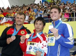David Boudia (der), Qiu Bo (centro) y Sascha Klein (izq) en la premiación de la prueba de plataforma de 10 mts. AP  /