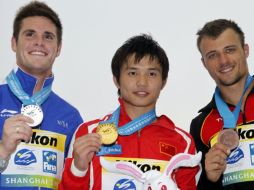 Qiu Bo ganó este domingo el título mundial en  plataforma de 10 metros masculina, en la competición de clavados. AP  /