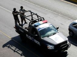 En promedio, el costo mensual por elemento es de 15 mil pesos. ARCHIVO  /