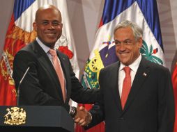 Martelly y Piñera mostraron mutuo apoyo para sus países en el Palacio de La Moneda en Santiago de Chile. AP  /