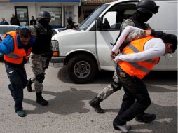 Entre los detenidos está el director de Seguridad Pública de Isidro Fabela, quien brindó protección a la célula. ARCHIVO  /