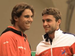 Nadal (izq.) y Gilles Simon se verán las caras en duelos de singles, el primero defendiendo a España y el segundo a Francia. AFP  /