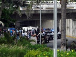 Los cuerpos fueron dejados en una vialidad del municipio de Boca del Río. AFP  /