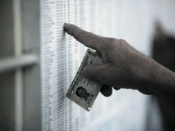 Pese al optimismo del presidente, la elección en la que está en juego su reelección está llena de acusaciones sobre anormalidades. AP  /