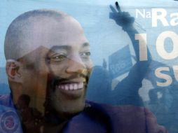 Seguidores de Joseph Kabila celebran la victoria en las elecciones; sostienen un cártel con la imagen del candidato. REUTERS  /