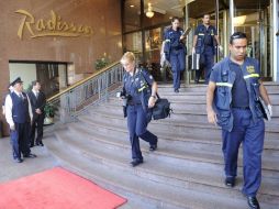 Autoridades realizan indagatorias en el hotel hotel Radisson, donde fue localizado el cadaver. AFP  /