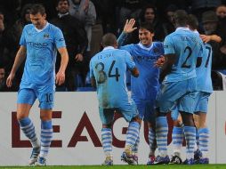 Todo apunta a que el técnico italiano vuelve a contar con Carlos Tévez de cara a un tramo final de la Premier League. AFP  /