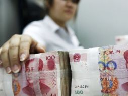 El yuan, también conocido como renminbi o dinero del pueblo, marcó un máximo récord de 6.2884 frente al dólar en febrero. ARCHIVO  /