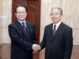 ''La amistad entre China y Corea del Norte es un tesoro precioso para nuestros dos partidos'', declaró Kim Yong-il (Izq.). ESPECIAL  /