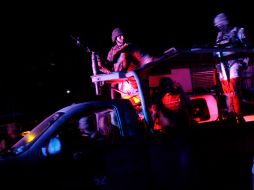 Miembros del Ejército mexicano llegan a la escena del crimen donde cuatro policías fueron asesinados en Acapulco. AFP  /