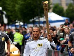 El piloto de McLaren declaró que fue un honor y un orgullo que lo eligieran para ser revelo de la llama. EFE  /