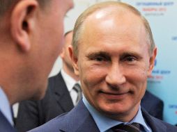 Putin y el primer ministro británico David Cameron asistieron a una competencia de judo femenil en los Juegos de Londres. XINHUA  /