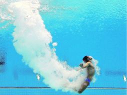 En su primera experiencia olímpica, Iván García se metió entre los ocho mejores de la plataforma individual. AP  /