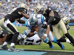 Jenkins y Harper no pudieron detener a Newton y evitar la anotación. AP  /