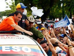 Capriles informó que a partir de mañana iniciará una última vuelta por 20 estados para cerrar la campaña. AFP  /
