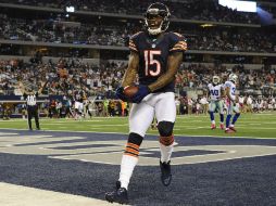 La anotación de Marshall sentenció el marcador (10-34) después que el pateador Robbie Gould logró el punto extra. EFE  /