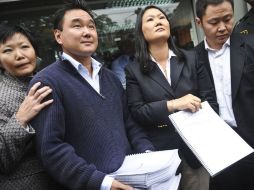Sachi, Hiro, Keiko and Kenji (De izq a der) los hijos del ex presidente con la solicitud formal de perdón humanitario. AFP  /
