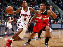 Los Hawks de Atlanta fueron por el camino del triunfo al imponerse 104-95 a los Wizards de Washington. AFP  /